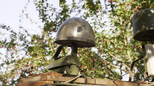 A mobile electronic warfare (EW) system mounted on a military vehicle, designed to disrupt enemy communications, drones and radar. using technology in military strategy