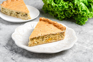 Chicken and egg pie on a light plate