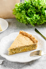 Chicken and egg pie on a light plate