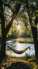 Obraz premium Tranquil River Camping Spot with Hammock