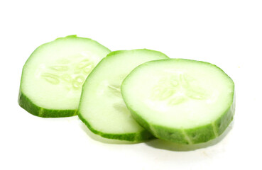 There are cucumbers on a white background - stock photo
