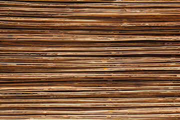 The shape, pattern and texture of a pile of bamboo boards. Board made from woven bamboo. Abstract line shapes. For graphic design or 3D rendering