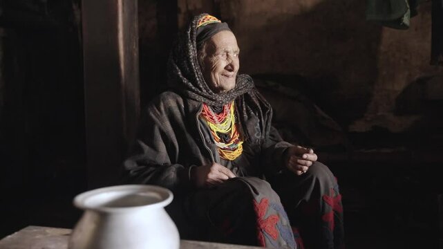 Kalash People. Oldest Woman in Bumburet Valley, Grandmother Kalashi. Elder woman in Hut at Winter, Chitral, Pakistan.