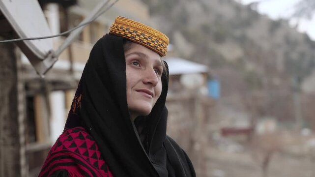Portrait Young Kalashi Woman, Beautiful Traditionally Dressed girl in in Bumburet Valley at Winter, Chitral, Pakistan.