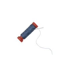 a spool of blue sewing thread with a needle