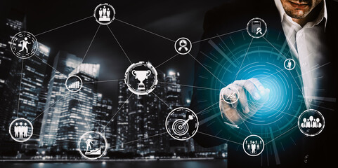 Achievement and Business Goal Success Concept - Creative business people with icon graphic interface showing employee reward giving for business success achievement. uds