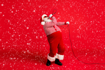 Full length body size view of his he handsome bearded fat overweight professional talented Santa...
