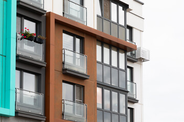 Modern high-rise apartment buildings in a vibrant residential area showcasing diverse architectural styles and community living