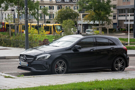 Mulhouse - France - 10 October 2024 - profile view of black Mercedes A45 parked in the street
