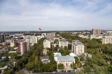 view from the top of the city of Bishkek with kyrgyz flag and buildings