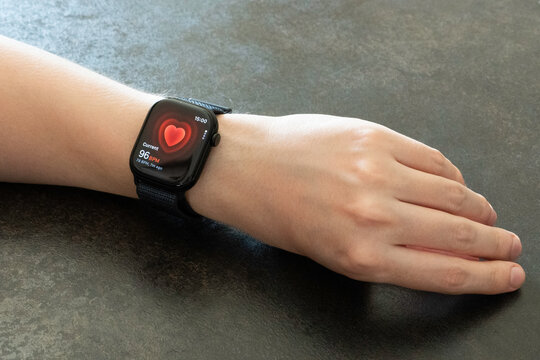 San Francisco, USA - October 4, 2024: Young Man's hand with Apple Watch Series 10 measuring heart rate. Apple Watch was created and developed by the Apple inc.