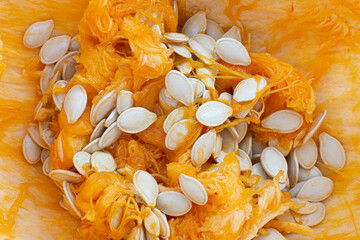 An abstract image of the texture of the inside of a pumpkin scrapped into a pile. 