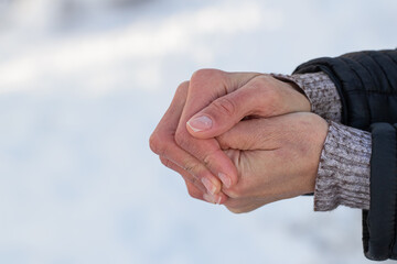 Womens hands in winter. Warmth and hand warming on cold winter days.