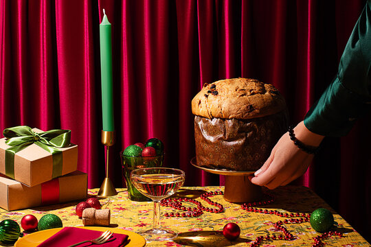 Festive Christmas table setting with Panettone and gifts
