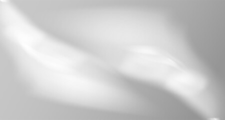 Glare from the sun's rays on the wall. Blurred shadows in the room. Soft overlay of natural light. Abstract background for product presentation.Natural light layout.