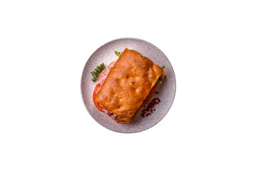 Focaccia with salami, cheese, tomatoes, arugula, salt, spices and herbs