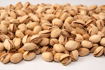 Tasty pistachios isolated on a white background.