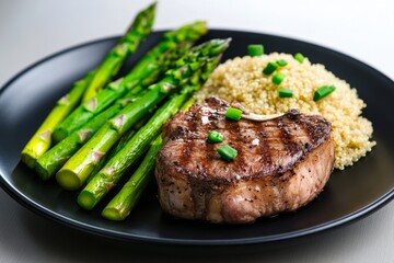 A perfectly portioned steak dinner with asparagus and quinoa, demonstrating a muscle-building dinner with balanced macronutrients