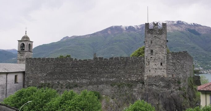 Lake Como, Dervio, Italy. Castle of Corenno Plinio on a cloudy day. Travel vacations in Italian Alps