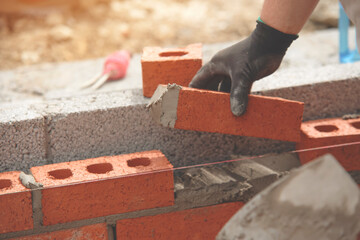 Blicklayer Crafting a solid structure with bricklaying skills in a sunny construction site