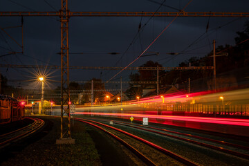 Light train railway color lines in night near Roudnice nad Labem town