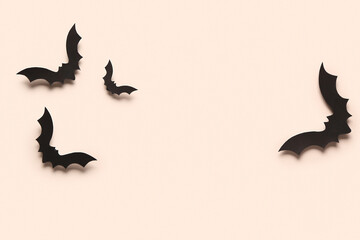 Paper bats for Halloween party on light background