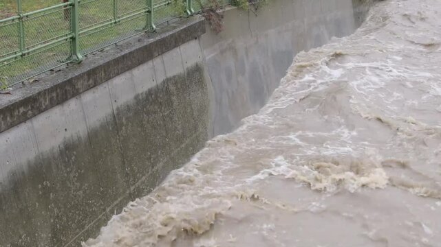 urban river during flooding in austria, high water