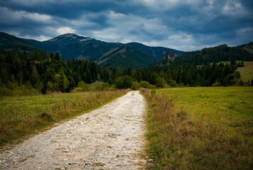 bright path through the landscape to the rocks