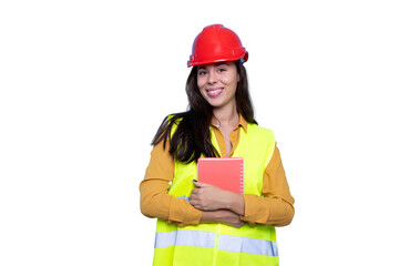 Confident young female engineer in a hard hat on a construction site