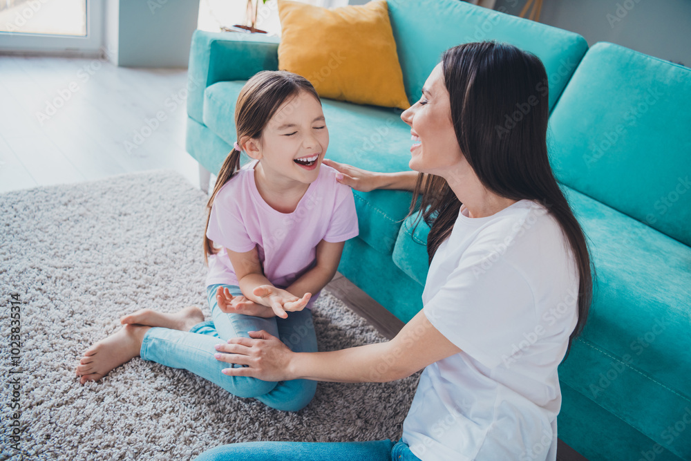 Poster Photo of good mood crazy family lovely adorable mother with daughter speaking together indoors cozy living room