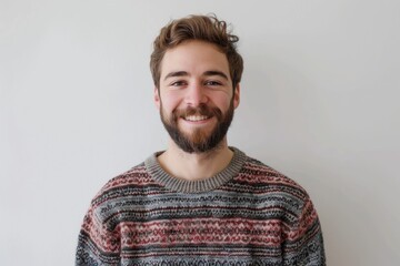Fototapeta premium Handsome man with beard smiling in casual sweater. Lucky.