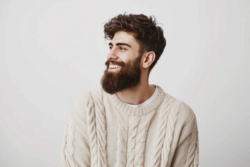Obraz premium Handsome man in casual sweater smiling confidently.