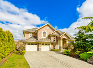 Fragment of a luxury house with a garage door in Vancouver, Canada. Horizontal orientation.