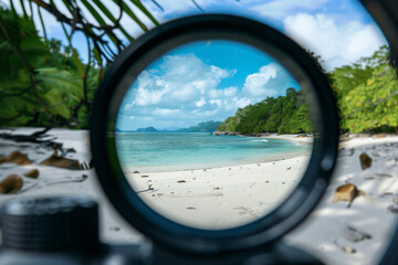 Fototapeta premium A view of a beach with a body of water in the background