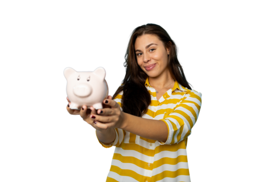 Smiling girl with a piggy bank in her hand
