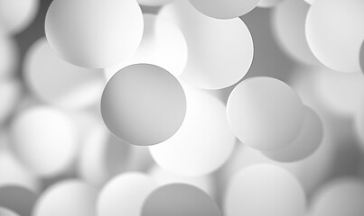 A blurry image of white circles with a gray background