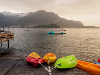 Kayaks and Boats on Lake Como in Lezzeno at Sunset