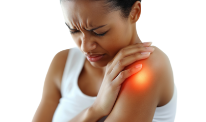 African American woman holding her shoulder in pain, isolated on transparent cutout background
