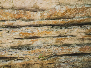 Sheer cliffs frame ancient ruins, reminiscent of past greatness, creating a mystical atmosphere and sense of time