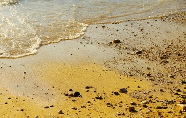 Sand on the beach in golden sunset