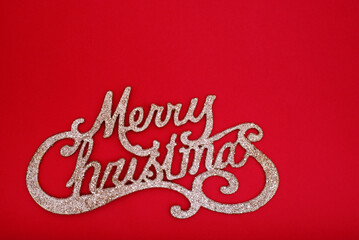 Merry Christmas sign on red paper background. Christmas background with copy space.