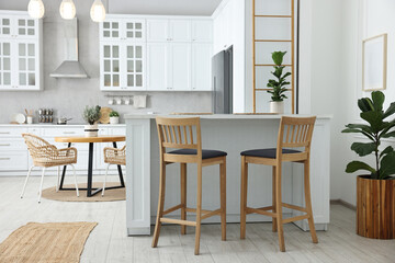 Stylish kitchen with bar stools. Interior design
