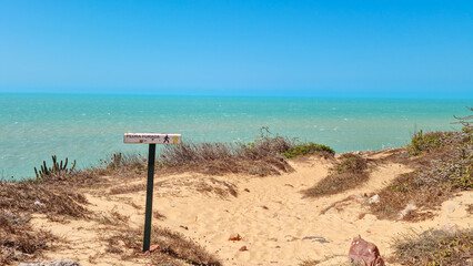 Hike to pedra furada at national park of Jericoacoara, Ceara, Brazil.