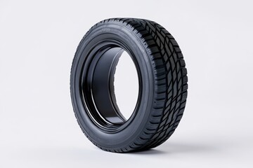 Obraz premium Black tire with tread design on a white isolate background.