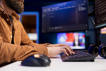 Developer working from apartment securing servers from DDoS attacks to avoid unwanted breakdowns....