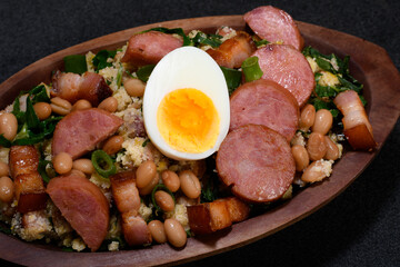 TROPEIRO BEANS, A TRADITIONAL DISH OF BRAZILIAN CUISINE FROM THE STATE OF MINAS GERAIS