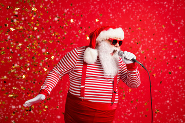 Photo of grandpa grey beard hold mic open mouth scream sing song karaoke wear santa claus x-mas...