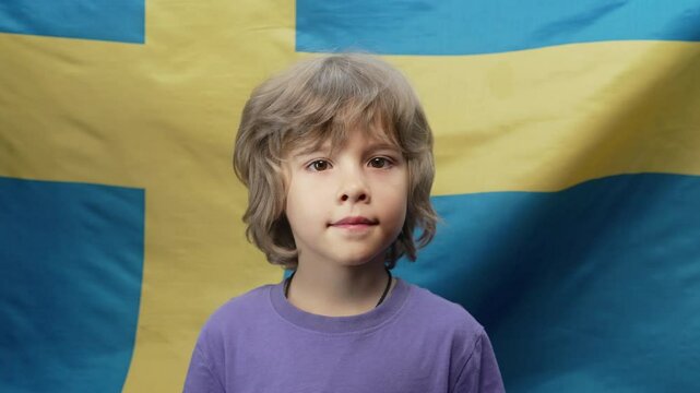 Happy swedish little Boy Patriot Kid, Sweden National Flag Background.