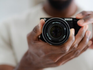 Camera being held with the lens in focus aimed at mirror