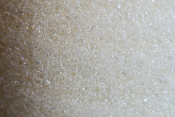 Close-up of Granulated Sugar Crystals. Detailed macro shot of texture and clarity of white granulated sugar crystals. Abstract background with sugar grains
